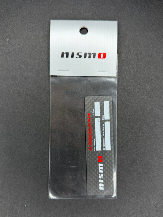 Nismo Oil Change Record Plate Carbon - KWAA0-50P00